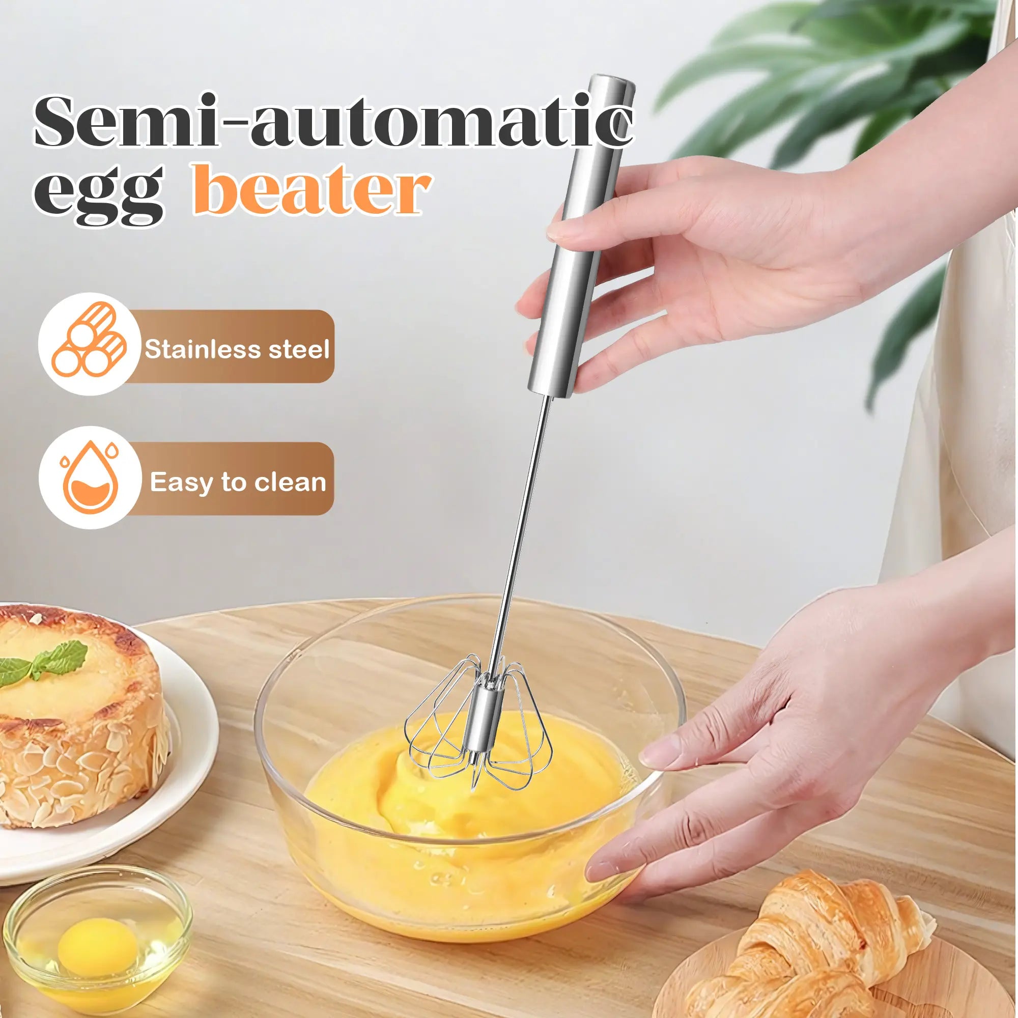 Hand pressing stainless steel rotary whisk into a mixing bowl