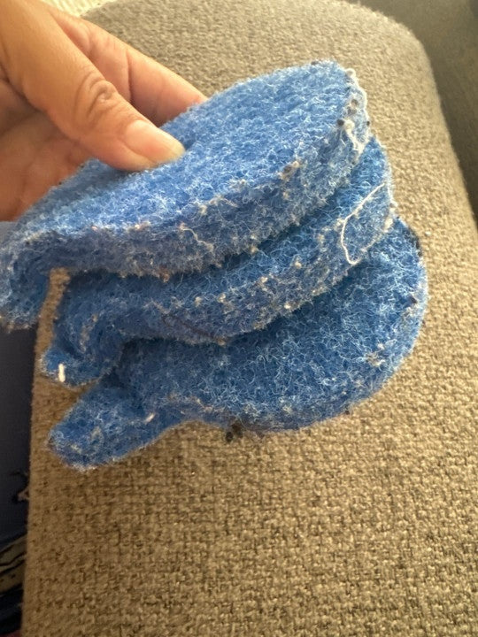 Pet owner reviewing reusable laundry catchers
