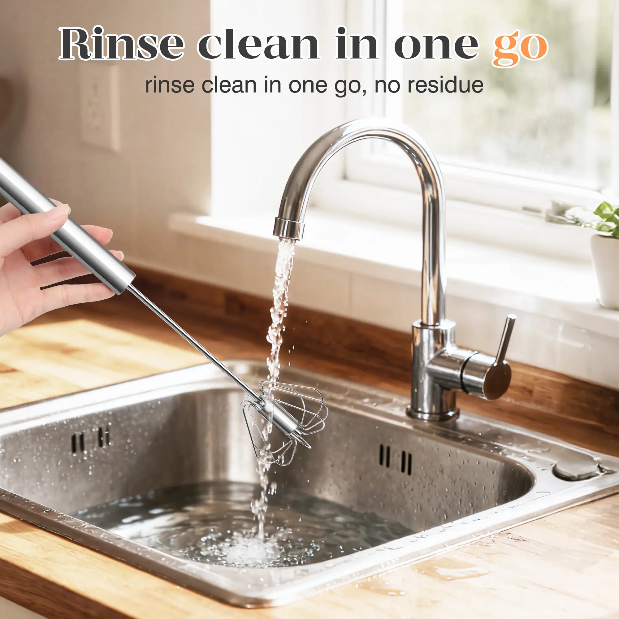 Rinsing the hand-push whisk under a kitchen faucet
